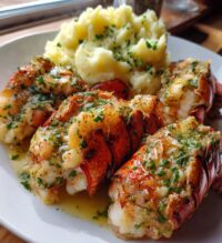 baked lobster tails with garlic herb butter sauce and mashed potatoes