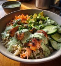 crunchy brown rice salmon bowls with herbed tahini dressing