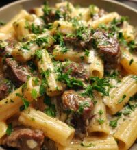 steak bites and penne in garlic parmesan velvety sauce