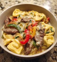 cheesesteak tortellini in rich provolone sauce