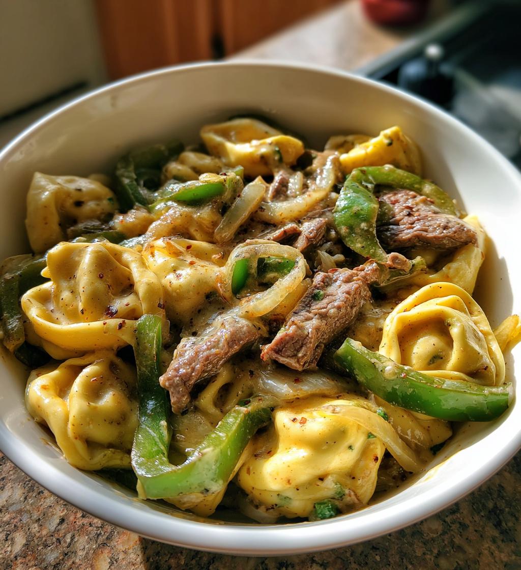 cheesesteak tortellini in rich provolone sauce